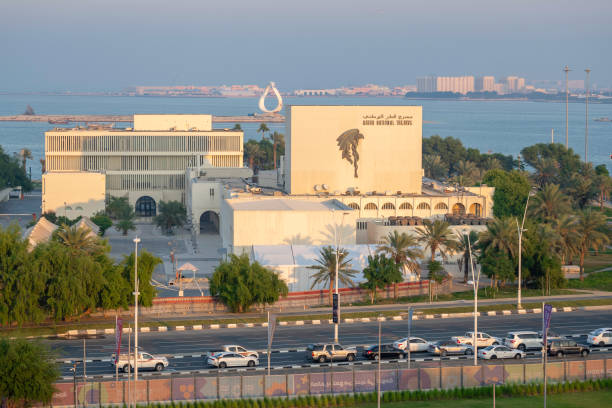 The exterior of the Qatar National Theatre view from Bidda Park Doha Corniche Doha, Qatar - November 14, 2023: The exterior of the Qatar National Theatre view from Bidda Park Doha Corniche qatar emir stock pictures, royalty-free photos & images