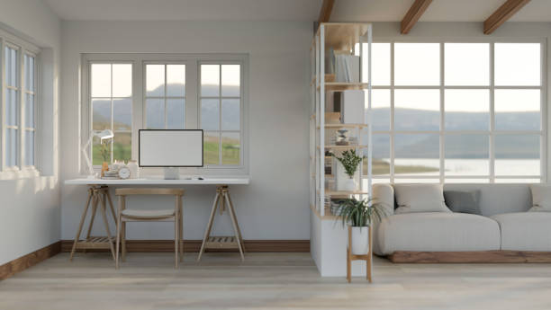 istock Minimal comfortable living room with table and mock up desktop computer with modern sofa. 1818082762