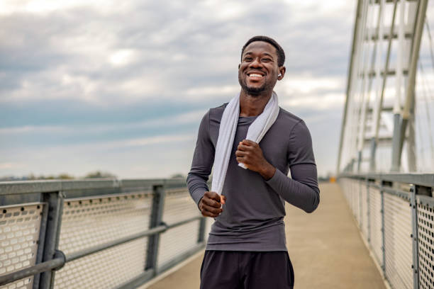 istock Fit athletic man after a workout standing outdoors. 1818084912
