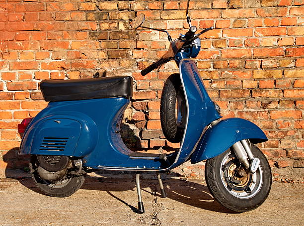 istock Blue scooter in front of a red brick wall 181808689