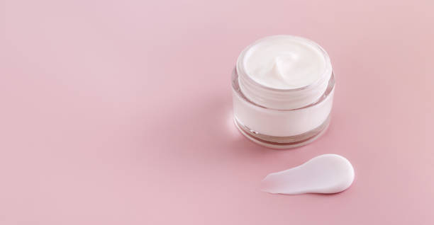 istock cream jar cosmetic smear cream texture on pastel pink background 1818103385