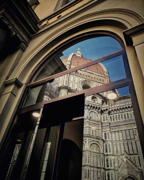 Colour shot of Florence cathedral reflected in a glass door