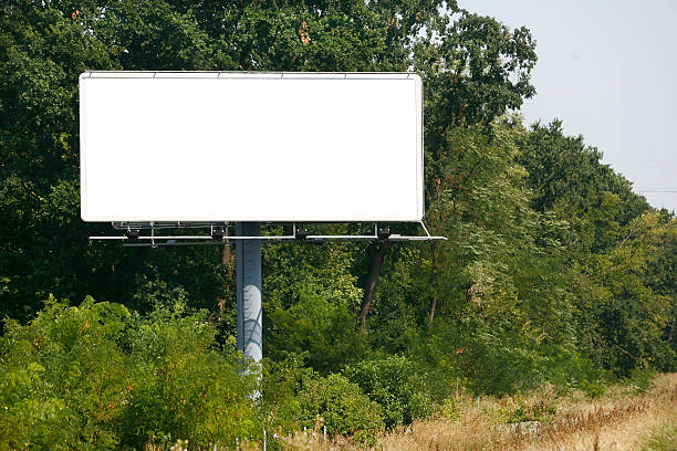 空の背景にビルボード/看板の夕暮れの空 - billboard posting ストックフォトと画像