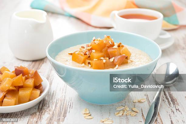 Oatmeal With Caramelized Peaches Tea And Yogurt Stock Photo - Download Image Now - Bowl, Breakfast, Caramelized