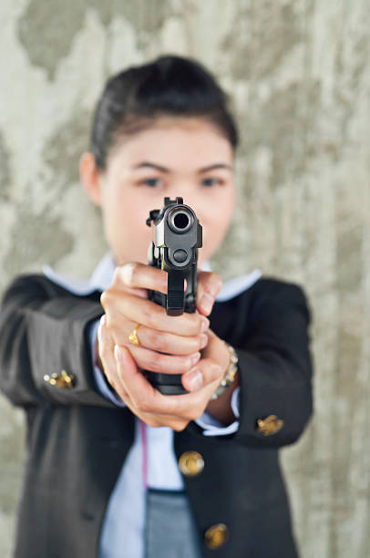 istock Beautiful Asian policewoman in action. 181813310