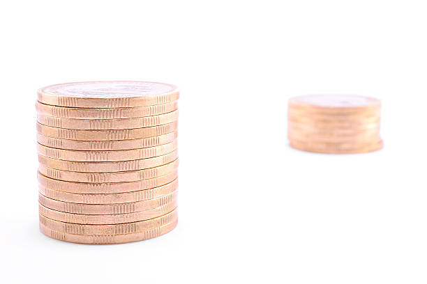 istock Two coins towers isolated on a white 181813715
