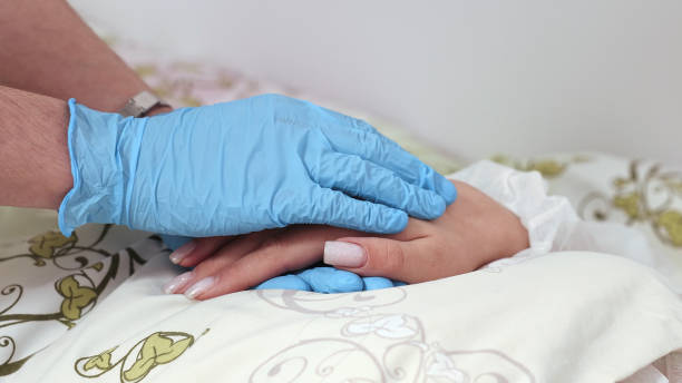 istock The nurse's hand strokes the patient's hand. 1818166409