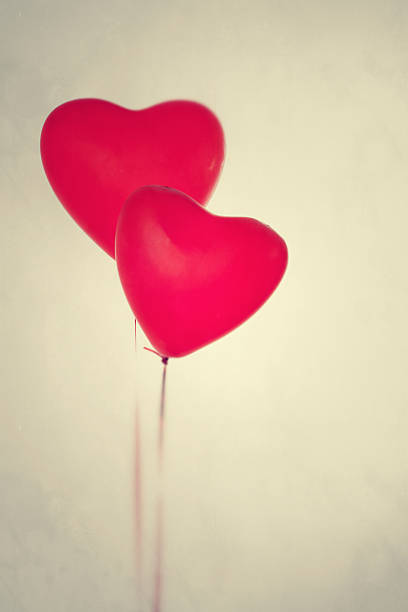 istock Two red Valentine's Day balloons on vintage bacground 181817149