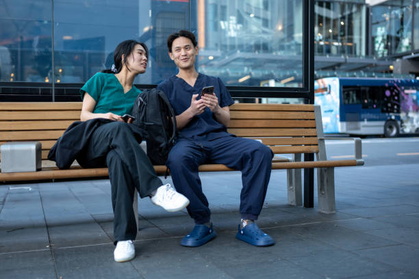 istock Medical Students on a Bench at the Bus Station 1818183769