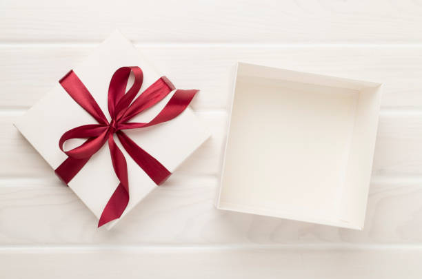 istock Open gift box on wooden background, top view. Mock up for design 1818195698