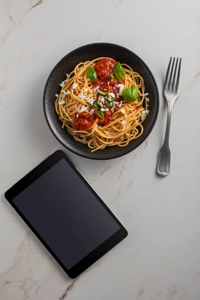 istock Pasta, spaghetti with tomato sauce in black bowl 1818203690