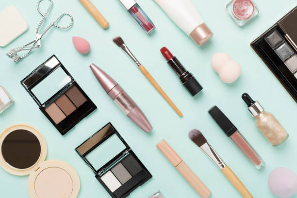 istock Flat lay with makeup products and tools on color background 1818205330