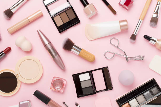 istock Flat lay with makeup products and tools on color background 1818205335