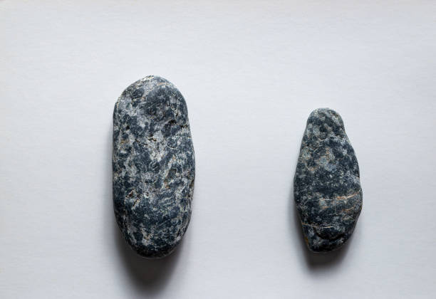 Hand axe stone tool representing ancient primitive human civilization and the history of archeology during the Paleolithic Age
