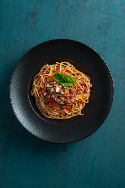 istock Pasta, spaghetti with tomato sauce in black bowl 1818216164