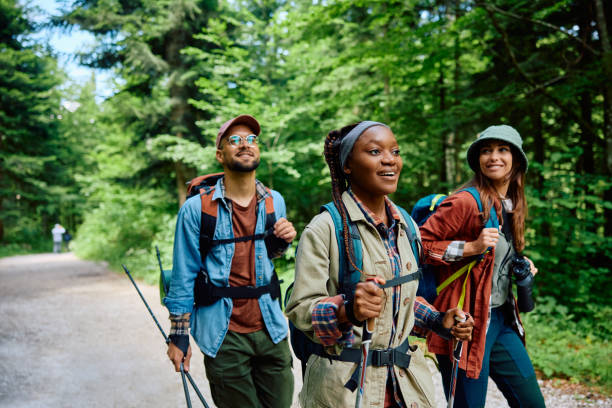 istock Young happy people taking a walk while hiking through nature. 1818220473