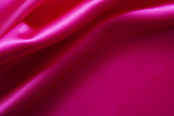 istock Pink silk or satin background, wavy, elegant and elegant Close-up, background. Space for designblur or blurry 1818260563