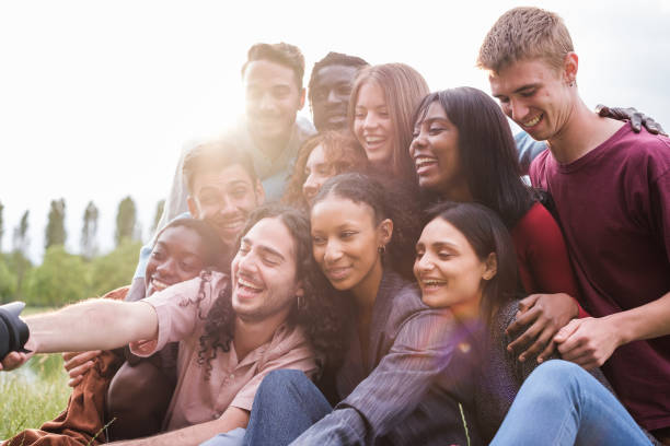 istock Group of young friends from different cultures taking a selfie outdoors after a fun afternoon 1818261003