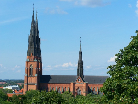 Panoramic view over the Martinitoren tower in the city of Groningen in The Netherlands from the Forum cultural center with a dramatic sky above.