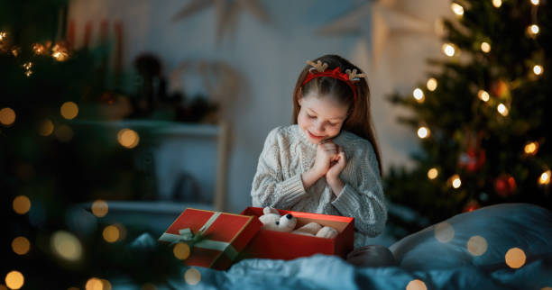 istock girl with Christmas gift 1818268462