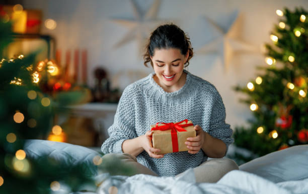 istock woman with Christmas present 1818270562