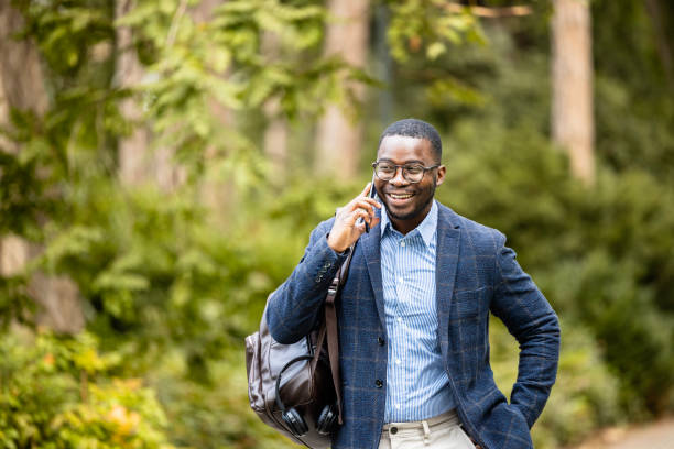 istock Busy elegant man walking to work and talking on the phone. 1818281273