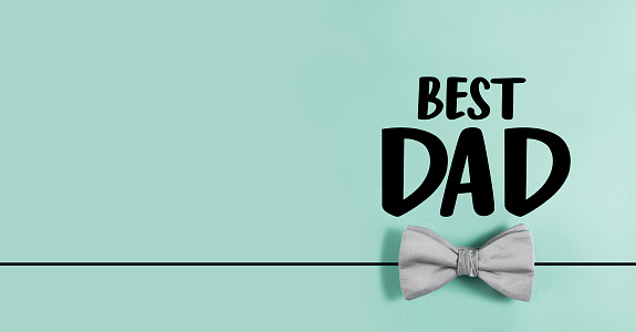 Best dad note with bow tie on green background