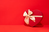 Heart Shaped Gift Box on Red Background
