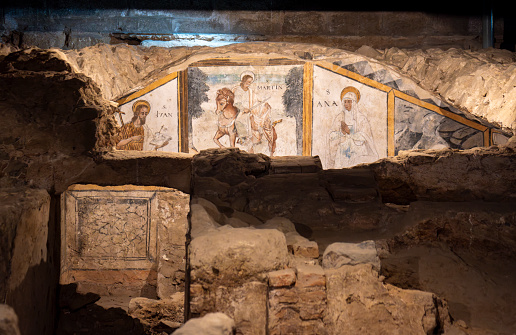 Remains ruins of religious paintings and frescoes from the early Christian crypt in the basements of the church of the martyr Santa Eulalia, patron saint of Mérida. Ancient early Christian necropolis. Merida, Spain.