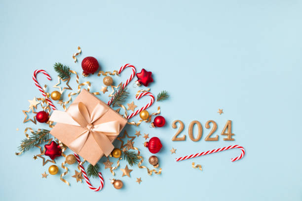 istock Gift or present box with 2024 numbers and Christmas decorations for New Year top view. 1818321929