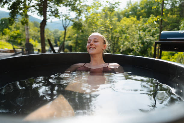 istock Young woman taking an ice bath 1818332347