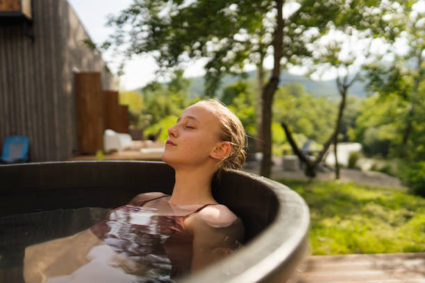 istock Young woman taking an ice bath 1818332867
