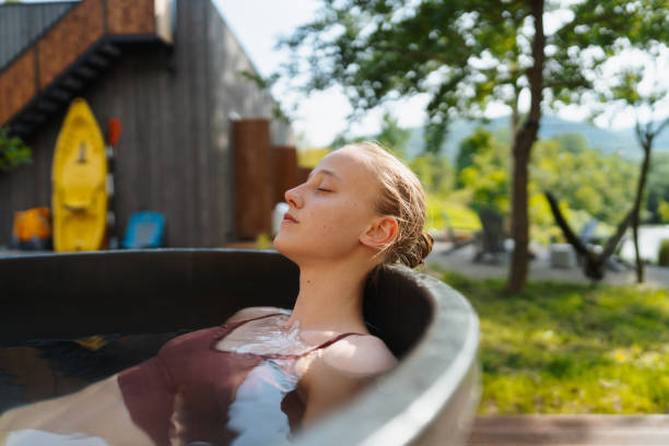 istock Young woman taking an ice bath 1818333387