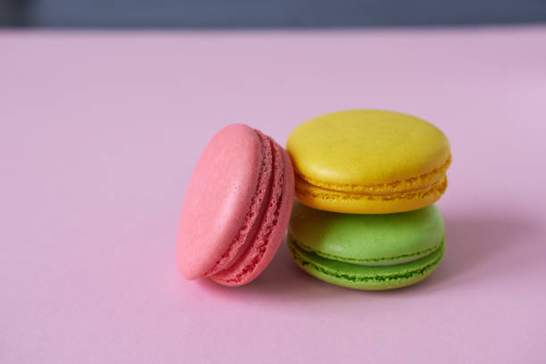 istock Colorful macaroons on a pink background. Selective focus. 1818334490