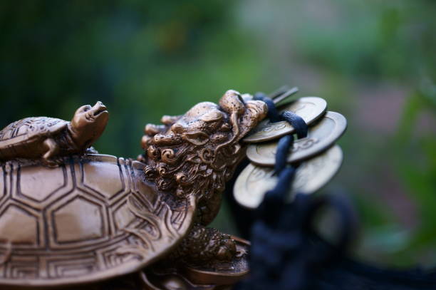 istock Dragon turtle figurine with Chinese coins. 1818339181