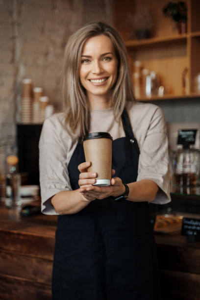istock Barista Offering Eco-friendly Takeaway Cup 1818344166
