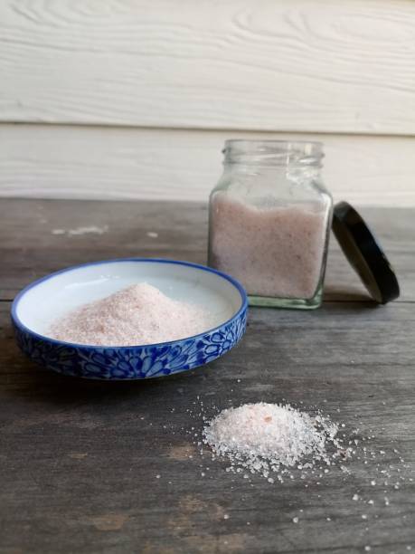 istock Himalayan pink salt on table wood background 1818345815