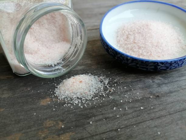istock Himalayan pink salt on table wood background 1818345820