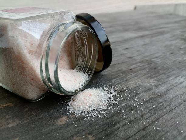 istock Himalayan pink salt on table wood background 1818345837