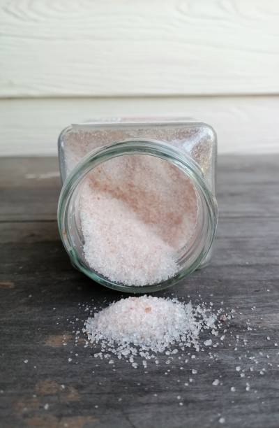 istock Himalayan pink salt on table wood background 1818345839