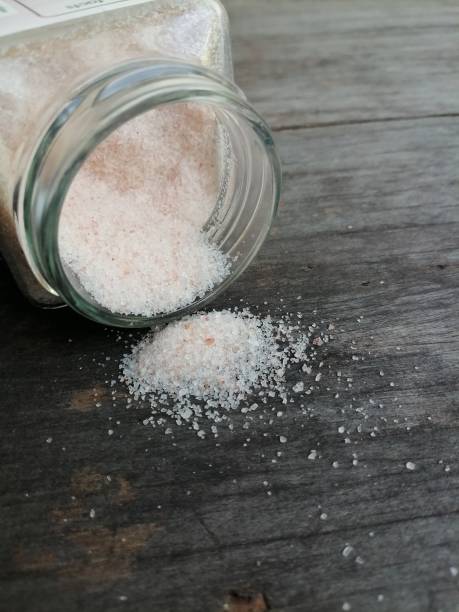 istock Himalayan pink salt on table wood background 1818345840