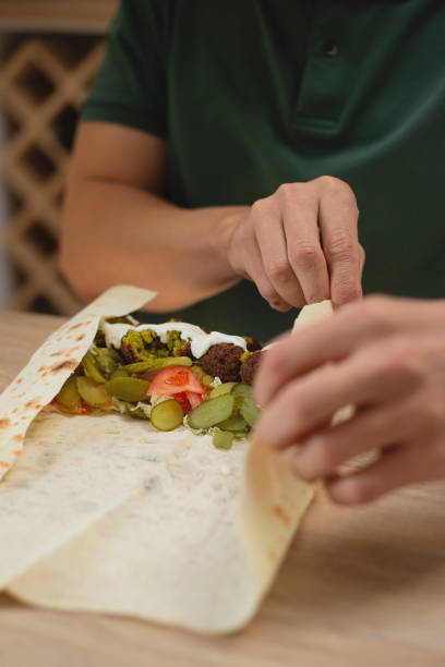 istock Man cooking homemade falafel meal. 1818347464