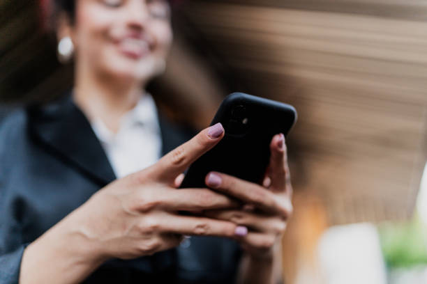 istock Close-up of a woman using mobile phone 1818351366