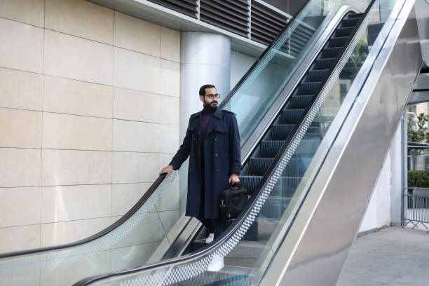 istock Arab businessman on an escalator 1818363862