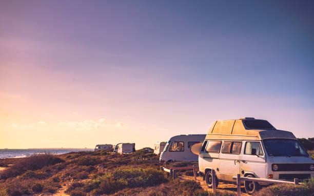 istock Camper cars on beach, camping on nature 1818376696