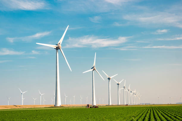 istock offshore windmill park with stormy clouds and a blue sky, windmill park in the ocean 1818382245