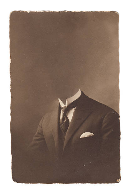 istock An old photograph of a man in a suit missing his head 181838499