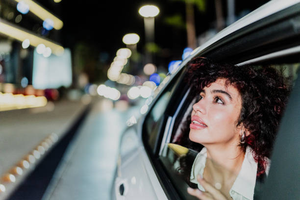 istock Young woman looking through the cab window 1818387077