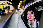 Young woman looking through the cab window
