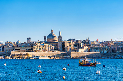 Valletta Malta city Skyline, colorful house balcony Malta Valletta city, view of the skyline from the water of Valletta Malta during sunset